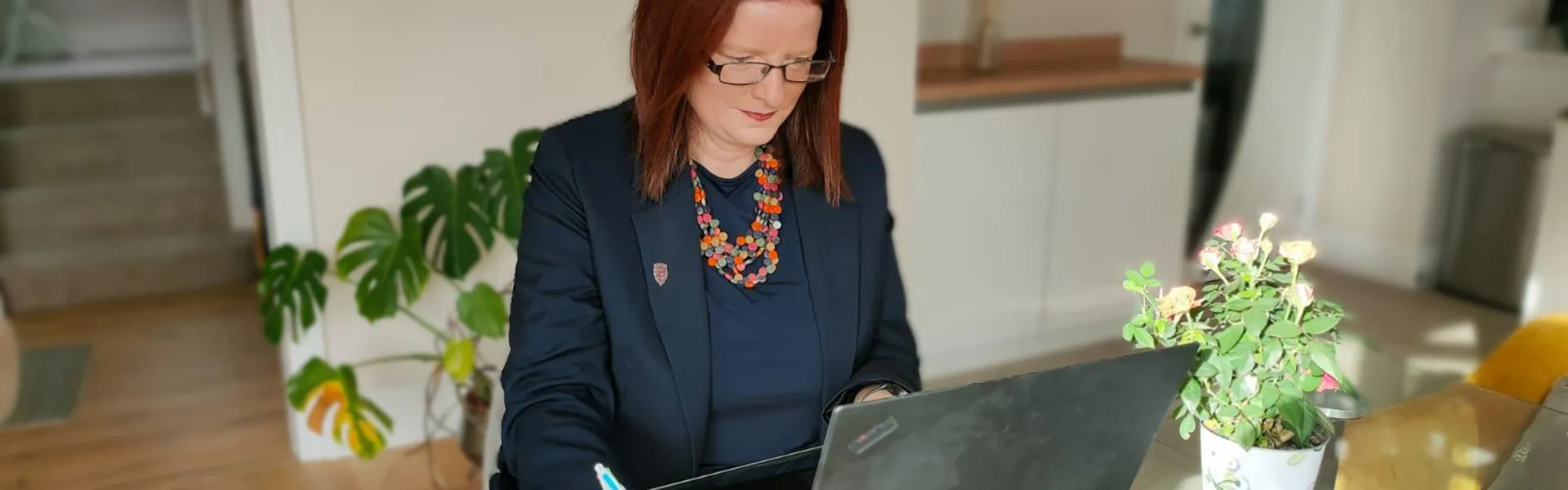 banner-working-at-laptop